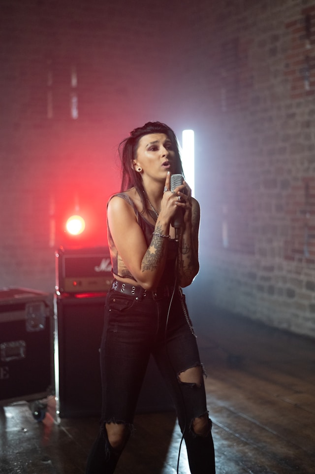 Band Member Rio on stage - cast in a red light